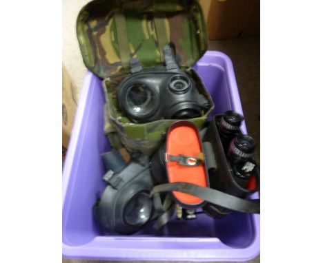 Two Army gas masks and a pair of 8x30 field binoculars (cased)