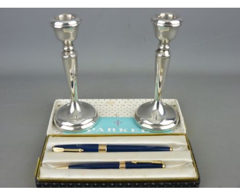 Vintage blue Parker 17 pen set in original case with instructions and a pair of loaded base silver candlesticks, Sheffield 19