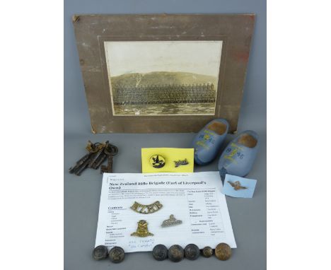 Group of military related items including a sterling silver sweetheart brooch and a pair of 1945 decorated wooden clogs 'Souv