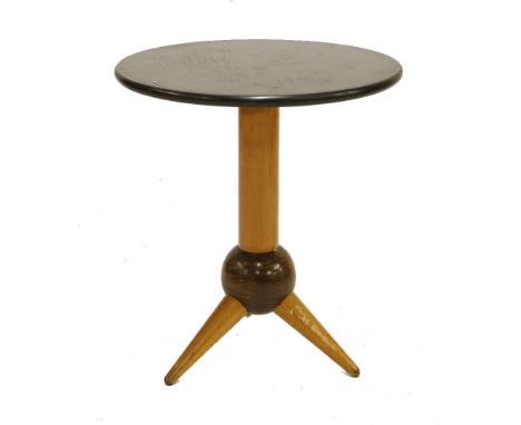 An ebonised and beech lamp table,raised on a tripod stand,50cm diameter55.5cm high