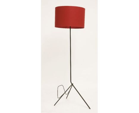 An iron standard lamp,with an integral magazine rack to the stand, later modern shade,145cm high