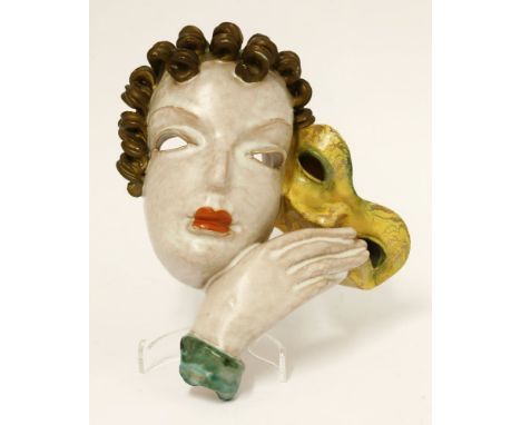 A Goldscheider Art Deco wall mask,designed by Rudolf Knörleinthe, with a glazed terracotta body modelled as a female holding 