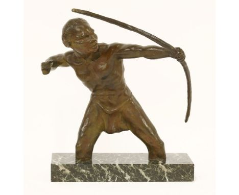 An Art Deco centrepiece of an African hunter with bow,on marble base, modelled standing knee deep in water, signed 'R. De Wan