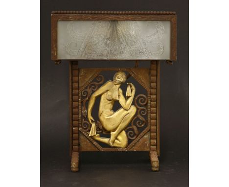 An Art Deco table lamp,designed by Paul Kiss, the iron frame centred with a gilded nude within an octagonal panel, the shade 