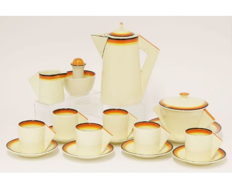 A Clarice Cliff part coffee set, each piece painted with concentric rings, comprising six cups and saucers, a milk jug and su