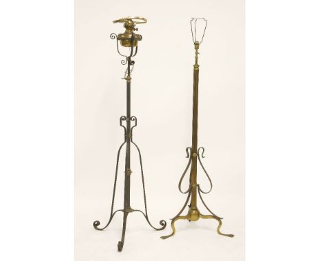 Two Arts and Crafts wrought iron and brass standard lamps,one converted from an oil lamp, both adjustable,155cm high (2)