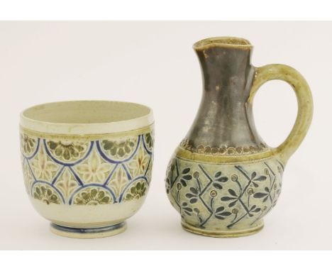 A Martin Brothers' stoneware jug,1880, with a band of stylised foliage below a brown-glazed neck, impressed 'Martin, Southall