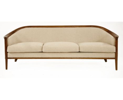 A lounge sofa,c.1960, designed by Bertil Fridhagen, produced by Trensum, Sweden, with original sprung cushions on a wooden fr