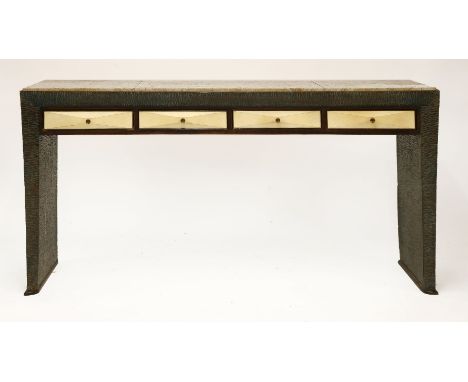 An Italian console table,by Borsani, the travertine top, broken, over a carved frame, with four vellum-fronted drawers,172cm 