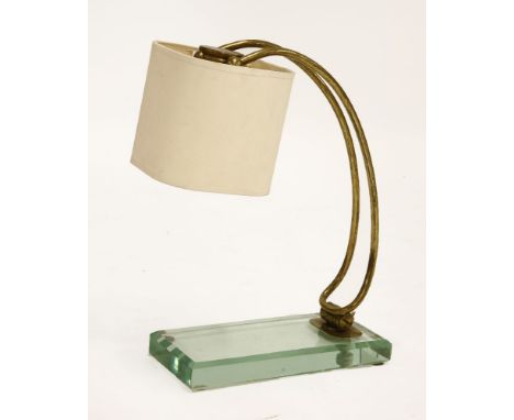 A FontanaArte table lamp,the hinged branch fixed to a bevelled glass plinth, with a modern shade,43cm high, andan ashtray,73c