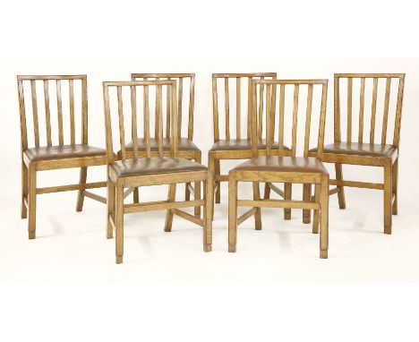 Six oak dining chairs,the design attributed to Edward Barnsley, each with drop-in seats, various stamped marks, 'R Foster and