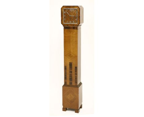 An Art Deco walnut and calamander inlaid grandmother clock,with a square chrome dial and Arabic numerals, 132cm high