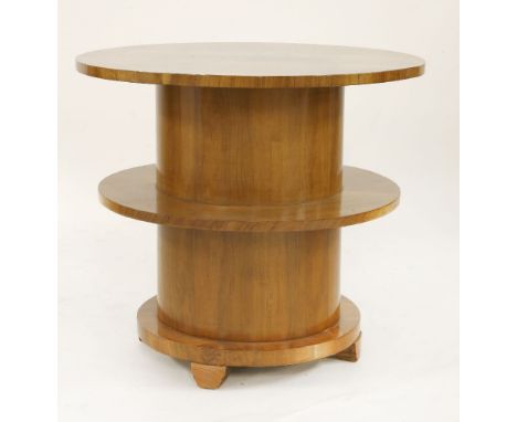 An Art Deco walnut circular centre table,with a quarter veneered top, raised on a column with a lower shelf, raised on block 