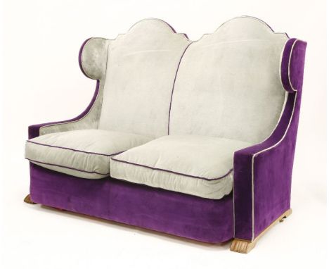 A French upholstered wingback sofa,attributed to Jean-Charles Moreux, 165cm wide