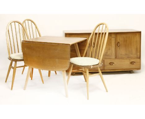 An Ercol dining suite,comprising:a drop-leaf table,136cm open74.5cm wide71.5cm high,a sideboard,with an arrangement of cupboa