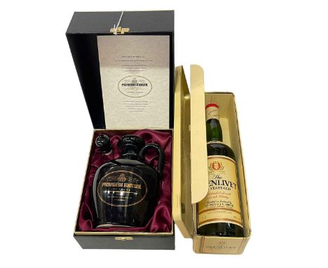 Two bottles of Scotch Whisky, Bowmore and Glenlivet.