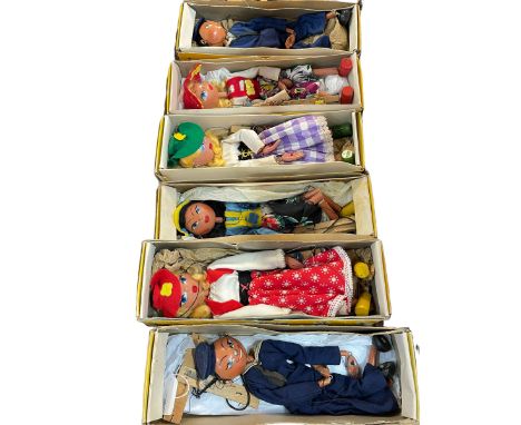 Six Pelham Puppets including Gretal, Sailor, Mitzi, etc. and four puppet books