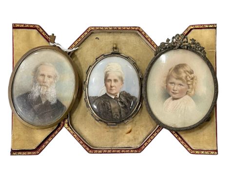 Three oval portrait miniatures, one with easel frame and one cased.