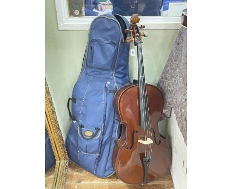 Cased Cello with bow and accessories.