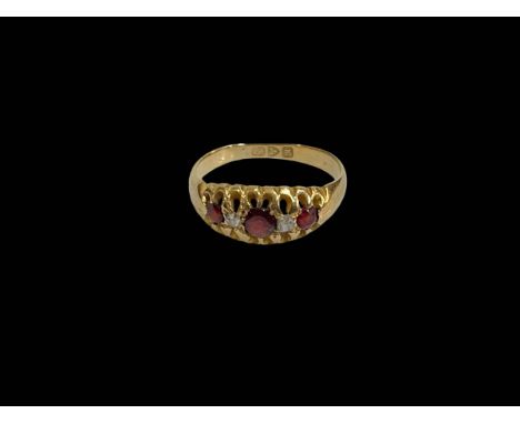 Ruby and diamond 18 carat gold ring, Chester 1912, size K/L.