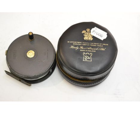 A Hardy 3 7/8inch Alloy 'Perfect' Fly Reel, with black handle, notched brass foot, agate lineguard, grey enamel finish, with 
