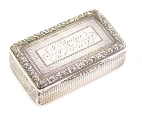 A Victorian silver snuff box, with chased decoration, scroll border and plain silver gilt interior, engraved lid, London 1842
