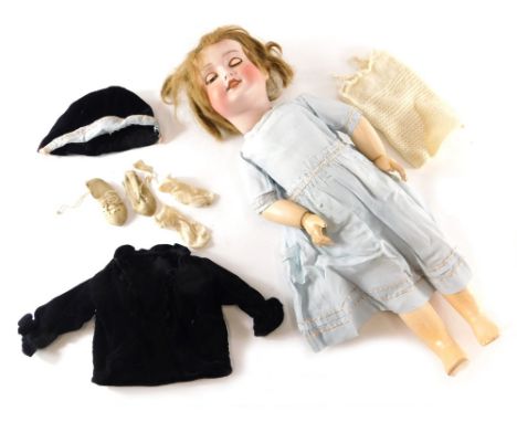 An early 20thC SFBJ bisque headed doll, with sleep eyes, open mouth showing teeth, with articulated limbs and dress, marked t