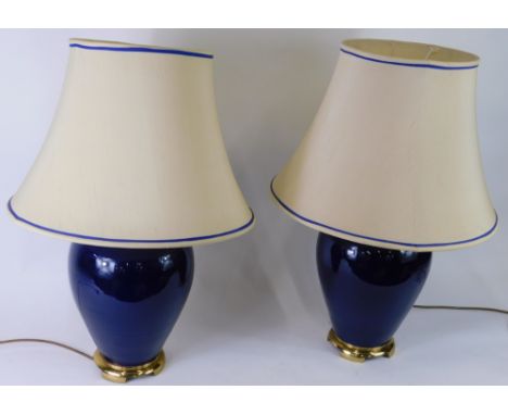 A pair of blue glazed and glass ceramic table lamps with shades, 71cm high.