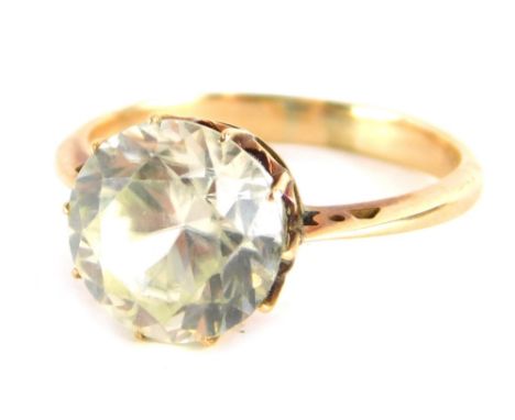 A moissanite dress ring, round brilliant cut, set in unmarked yellow metal, 9.4mm x 5.4mm, ring size L½. 2.9g all in.