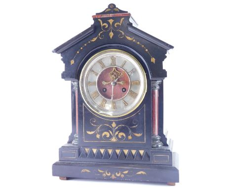 A 19thC black slate and marble mantel clock, in architectural case, with 17cm diameter Roman numeric dial, flanked by quarter