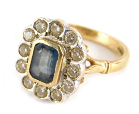 A 9ct gold dress ring, with baguette cut central green stone surrounded by small white stones, on a plain shank, size M, 4.2g