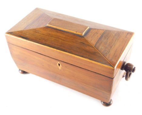 An early 19thC rosewood tea caddy, of sarcophagus form with ring handles, on compressed bun feet with fitted interior, remova