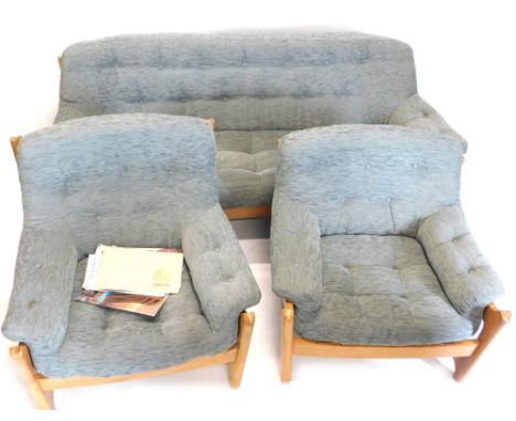 An Ercol Wychwood elm three piece suite, re-upholstered in grey fabric, the sofa 189cm wide.   Purchased 1979 and sold with t