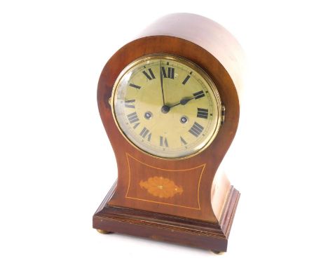 An Edwardian mahogany balloon clock, with 16cm diameter Roman numeric dial, floral inlay, compressed orb feet and eight day m