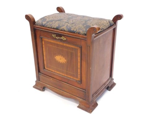 An Edwardian walnut and inlaid piano stool, with a padded seat, the fall front enclosing divisions for sheet music, retailed 