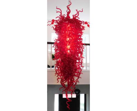 A large and impressive Murano centrepiece chandelier or shade, set with various red glass shaped sections, on a central taper