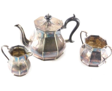 A three piece silver plated tea service, comprising teapot, two handled sugar bowl and milk jug, 9cm high.