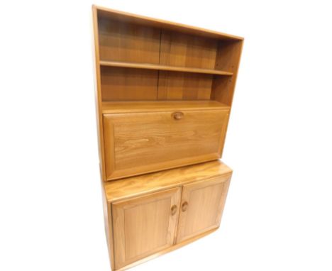 An Ercol light coloured elm dresser, the raised back with two shelves above a fall front section, the base with two doors, ea