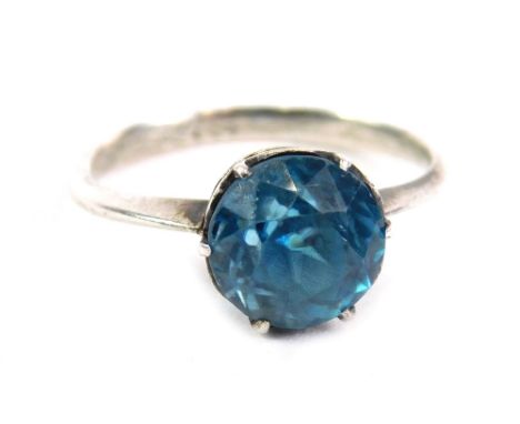 A dress ring, claw set with blue zircon, size N.