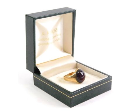 A 9ct gold dress ring, inset with red stone, size G, 5.3g all in.