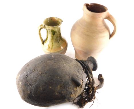 A West Country style lead glazed stoneware jug, with beak spout, partially glazed in green and marked, 28cm high, a further u