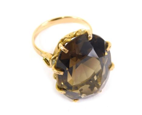 An 18ct gold dress ring, claw set with large citrine coloured stone, size N, 11.6g all in.