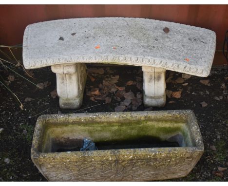 A WEATHERED COMPOSITE CURVED BENCH, on twin scrolled supports, length 110cm, and a rectangular planter, condition report: bot