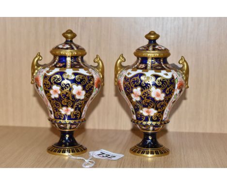 TWO ROYAL CROWN DERBY IMARI '6249' LIDDED URN VASES comprising a pair of lidded urn formed vases with gilt decoration, height