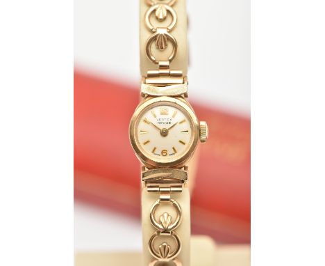 A LADIES 9CT GOLD 'VERTEX REVUE' WRISTWATCH, manual wind, round light gold dial signed 'Vertex Revue' Arabic twelve and six w