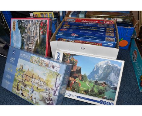 THREE BOXES OF JIGSAW PUZZLES, over twenty five puzzles of which eight are still sealed, makes include Ravensburger, MB, Gibs