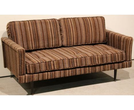 A 1957 iron-framed sofa (converts into single)