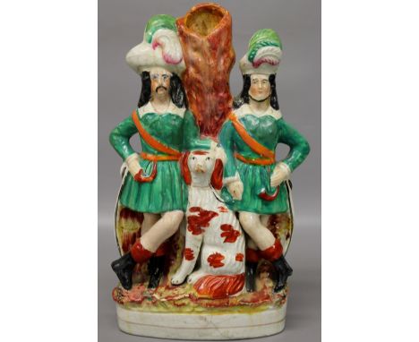 A Victorian Staffordshire figural spill vase (huntsmen & hunting dog)