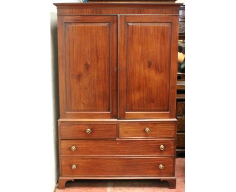 19th century mahogany linen press, the cupboard with two panel doors above two short and two long drawers, 192cm high and 119