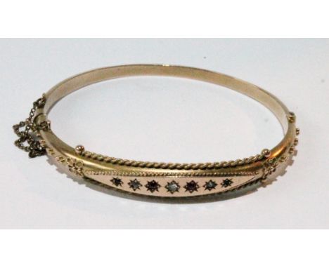 9ct gold hinged bangle with rubies and rose diamonds, star-set, Chester 1895.